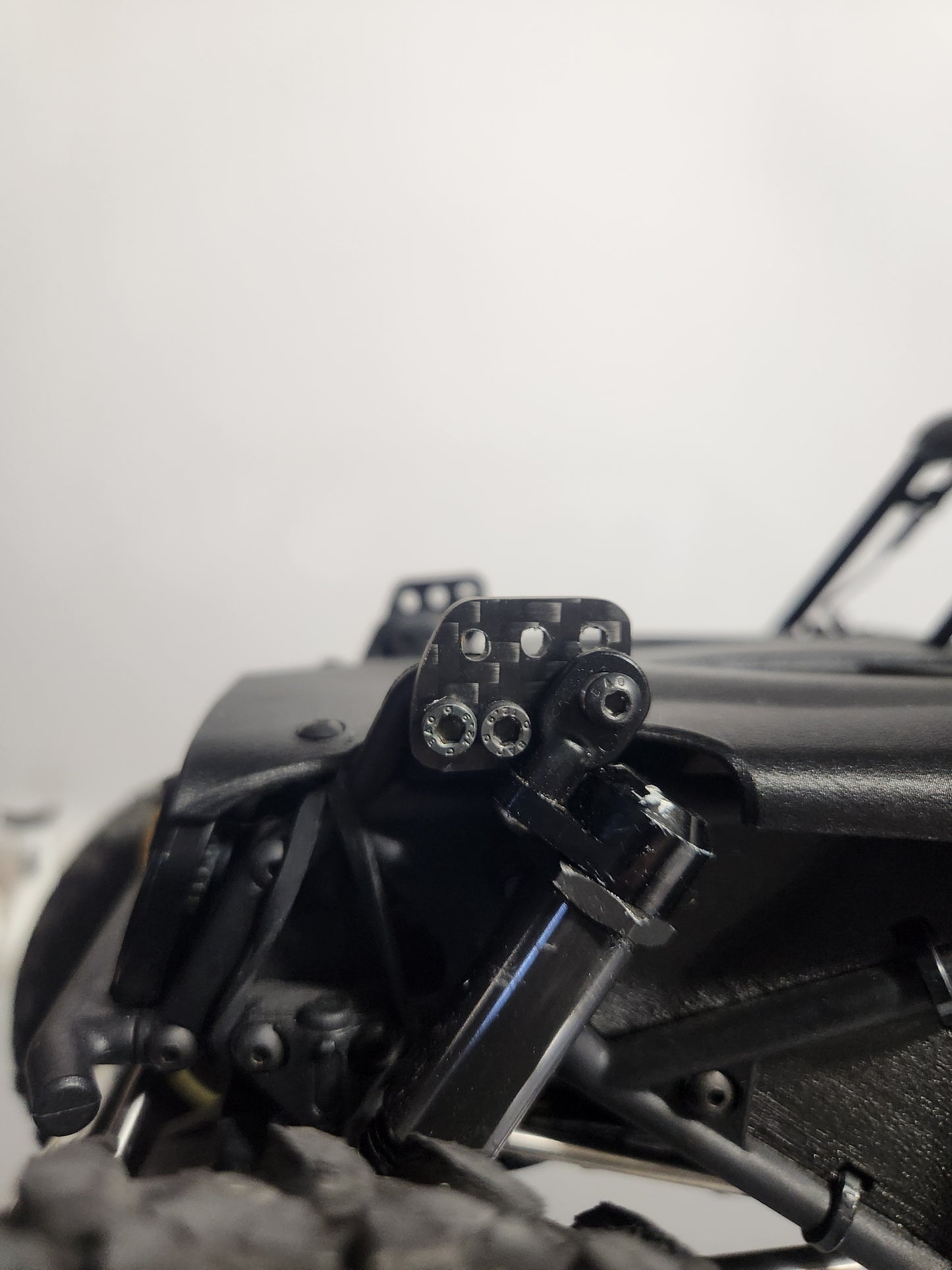 H10 Shock relocation bracket. Carbon fiber.